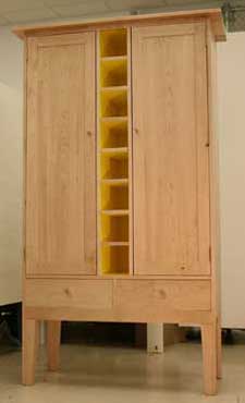 maple cabinet with 8 yellow pigeon-hole cubbies center, vertical