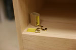 Pigeon-Hole Cabinet maple cabinet with 8 yellow pigeon-hole cubbies center, vertical