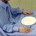 tablecloth enclosing its diners